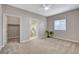 Spacious main bedroom offering carpeted floors, a ceiling fan, and plenty of natural light at 5250 S Rainbow Blvd # 2165, Las Vegas, NV 89118