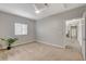 Main bedroom features carpeted floors, gray walls and large window allowing plenty of sunlight at 5250 S Rainbow Blvd # 2165, Las Vegas, NV 89118