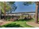 Serene park area with seating, shade structures, and lush landscaping for outdoor relaxation at 5250 S Rainbow Blvd # 2165, Las Vegas, NV 89118