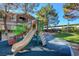 A safe and fun playground for children with slides, climbing structures and benches in a Gathering-friendly community at 5250 S Rainbow Blvd # 2165, Las Vegas, NV 89118