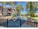 Colorful community playground featuring slides, benches, and shaded areas for children to enjoy at 5250 S Rainbow Blvd # 2165, Las Vegas, NV 89118