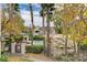 Community pool area with lounge chairs, a rock feature, and tropical palm trees at 5250 S Rainbow Blvd # 2165, Las Vegas, NV 89118
