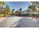 Community street lined with lush greenery and well-maintained townhome exteriors at 5250 S Rainbow Blvd # 2165, Las Vegas, NV 89118