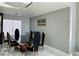 Elegant dining room featuring a modern table, designer chairs, and marble floors at 5568 Yellow Ash St, Las Vegas, NV 89118