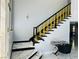 Stylish staircase featuring bold black and gold accents and sleek, modern design elements at 5568 Yellow Ash St, Las Vegas, NV 89118