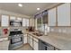 Updated kitchen featuring stainless steel appliances and ample counter space at 5846 Dana Rogers Dr, Las Vegas, NV 89110