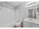 Bathroom featuring a bathtub, tiled shower, vanity, and neutral paint at 6413 Chippindale Ln, Las Vegas, NV 89108