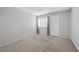 Bedroom featuring neutral carpet, freshly painted walls, and large window at 6413 Chippindale Ln, Las Vegas, NV 89108