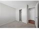 Neutral bedroom featuring carpeted floors, closet, and a white door at 6413 Chippindale Ln, Las Vegas, NV 89108