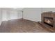 Spacious living room featuring tile floors, a fireplace, and neutral-colored walls at 6413 Chippindale Ln, Las Vegas, NV 89108