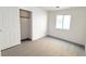 Bedroom featuring neutral carpets, white paint, and closet with sliding doors at 6533 Adonis Heights Ave, North Las Vegas, NV 89086