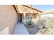 Front door and walkway with minimalist desert landscaping in front of the house at 6533 Adonis Heights Ave, North Las Vegas, NV 89086