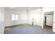 View of the living room that features fresh white paint and new carpets at 6533 Adonis Heights Ave, North Las Vegas, NV 89086