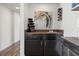 Stylish wet bar area with cabinetry, countertop space, and convenient wine storage at 6775 Segura Dr, Las Vegas, NV 89103