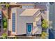 An aerial view of a home with a tile roof, solar panels and a private pool at 7331 Abundant Harvest Ave, Las Vegas, NV 89131