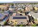 A home with solar panels set in a suburban neighborhood with manicured desert landscaping at 7331 Abundant Harvest Ave, Las Vegas, NV 89131
