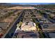 Stunning aerial view of a home near the popular Gilcrease Orchard, with a solar-paneled roof and well-kept yard at 7331 Abundant Harvest Ave, Las Vegas, NV 89131