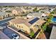 Aerial view of a landscaped backyard, showcasing desert landscaping, solar panels, and an extended driveway at 7331 Abundant Harvest Ave, Las Vegas, NV 89131