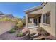 Landscaped backyard featuring a covered patio area perfect for outdoor dining and relaxation at 7331 Abundant Harvest Ave, Las Vegas, NV 89131