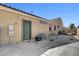 Backyard shows side of house with solar panel unit and concrete patio at 7331 Abundant Harvest Ave, Las Vegas, NV 89131