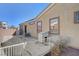 Backyard features concrete patio, small dog house, perimeter fence and desert landscaping at 7331 Abundant Harvest Ave, Las Vegas, NV 89131