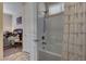 Bathroom with a shower and bathtub combination and neutral colors at 7331 Abundant Harvest Ave, Las Vegas, NV 89131