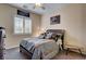 Cozy bedroom with a comfortable bed, neutral colors and a ceiling fan at 7331 Abundant Harvest Ave, Las Vegas, NV 89131