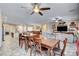 Open-concept living area featuring a spacious dining area and tile floors at 7331 Abundant Harvest Ave, Las Vegas, NV 89131