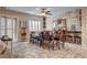 Dining room with tile floors, abundant natural light, and a decorative brick accent wall at 7331 Abundant Harvest Ave, Las Vegas, NV 89131