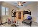This exercise room includes tile floors, a sauna, and a ceiling fan at 7331 Abundant Harvest Ave, Las Vegas, NV 89131