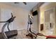 The exercise room has tile floors and an entrance to a bathroom at 7331 Abundant Harvest Ave, Las Vegas, NV 89131