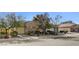 Attractive exterior view showcasing the home's well-maintained lawn and multi-car garage at 7331 Abundant Harvest Ave, Las Vegas, NV 89131