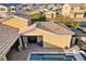 Inviting front entryway with a tiled roof, outdoor seating, and double doors leading into the residence at 7331 Abundant Harvest Ave, Las Vegas, NV 89131
