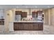 A kitchen with a center island, stainless steel appliances, and granite countertops at 7331 Abundant Harvest Ave, Las Vegas, NV 89131