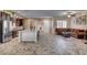 Open floor plan showing dining area, living room, and kitchen with neutral paint colors at 7331 Abundant Harvest Ave, Las Vegas, NV 89131
