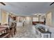 Open floor plan showing dining area, living room, and kitchen with neutral paint colors at 7331 Abundant Harvest Ave, Las Vegas, NV 89131