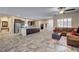 Spacious open floor plan with a large kitchen island, tile floors and comfortable seating area at 7331 Abundant Harvest Ave, Las Vegas, NV 89131
