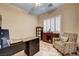 Home office with desk, accent chair, and storage cabinets at 7331 Abundant Harvest Ave, Las Vegas, NV 89131