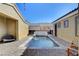 Inviting pool with beautiful brickwork and tiled waterfall feature is perfect for backyard relaxation at 7331 Abundant Harvest Ave, Las Vegas, NV 89131