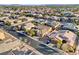 An aerial view of a quiet suburban neighborhood with mature trees and well-kept homes at 7331 Abundant Harvest Ave, Las Vegas, NV 89131