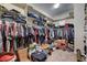 Spacious walk-in closet with extensive shelving and hanging racks for optimal storage and organization at 7331 Abundant Harvest Ave, Las Vegas, NV 89131