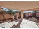 Covered backyard patio featuring a built-in grill and desert landscape at 7501 Bush Garden Ave, Las Vegas, NV 89129
