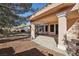 Covered backyard patio featuring a low-maintenance desert landscape at 7501 Bush Garden Ave, Las Vegas, NV 89129