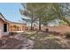 Well-maintained backyard featuring desert landscaping, walkway and covered patio at 7501 Bush Garden Ave, Las Vegas, NV 89129