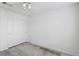 Clean bedroom with neutral carpet, a ceiling fan with lights, and a closet with sliding doors at 7501 Bush Garden Ave, Las Vegas, NV 89129
