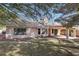 The house boasts a well-maintained lawn, covered patio and neutral color palette at 7501 Bush Garden Ave, Las Vegas, NV 89129