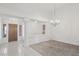 Bright open foyer with tile flooring, columns, and a chandelier at 7501 Bush Garden Ave, Las Vegas, NV 89129