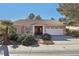 Charming single-story home featuring a well-manicured yard and a two-car garage at 7501 Bush Garden Ave, Las Vegas, NV 89129