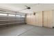 Spacious garage with ample storage cabinets, overhead door and epoxy flooring at 7501 Bush Garden Ave, Las Vegas, NV 89129