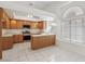 Bright kitchen with tile floors, oak cabinets, and stainless steel appliances at 7501 Bush Garden Ave, Las Vegas, NV 89129